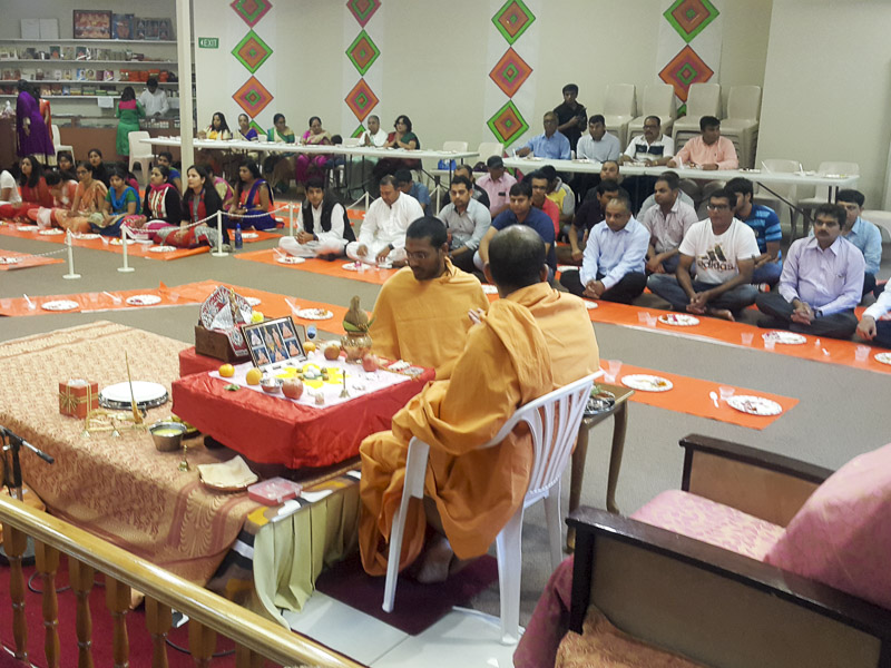 Devotees participate in the patotsav mahapuja rituals