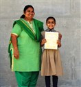 Students receive their certificates from campus director, Dr. Neeta Shah