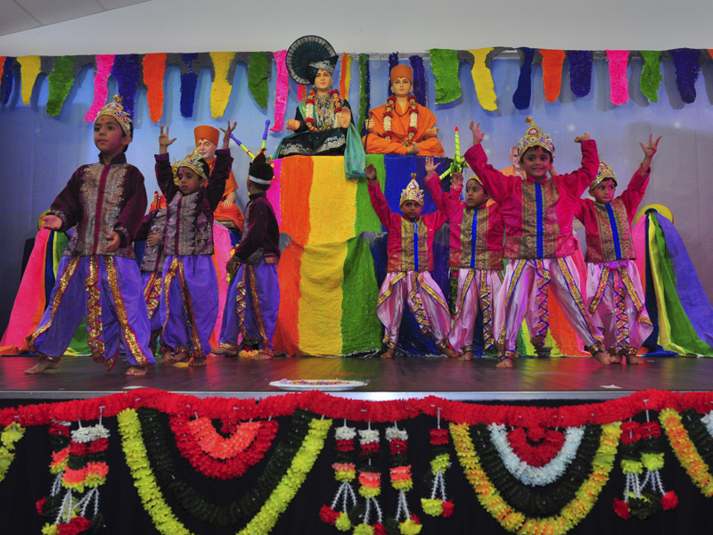 Children perform a cultural dance in pushpadolotsav assembly
