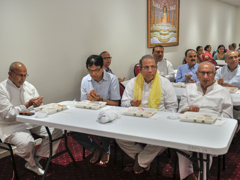 Devotees participate in patotsav mahapuja rituals