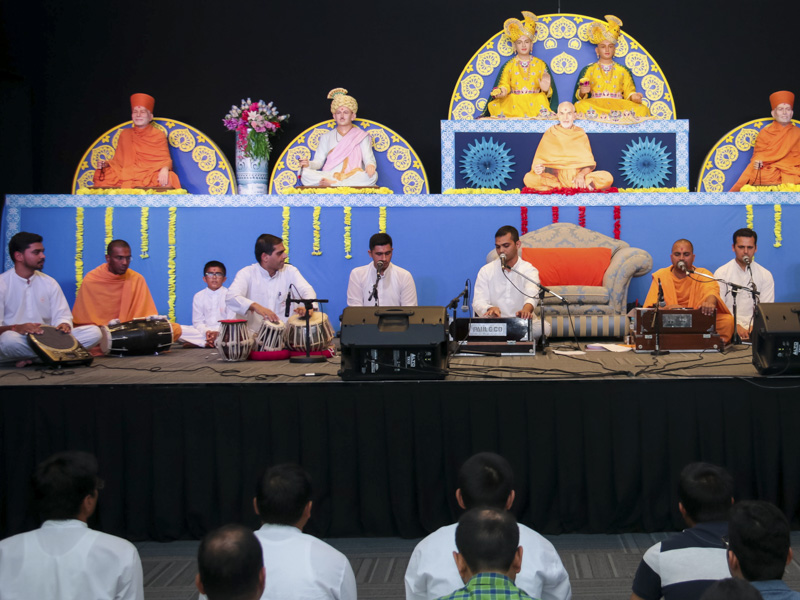 Sadhus and youths sing kirtans in the kirtan aradhana assembly