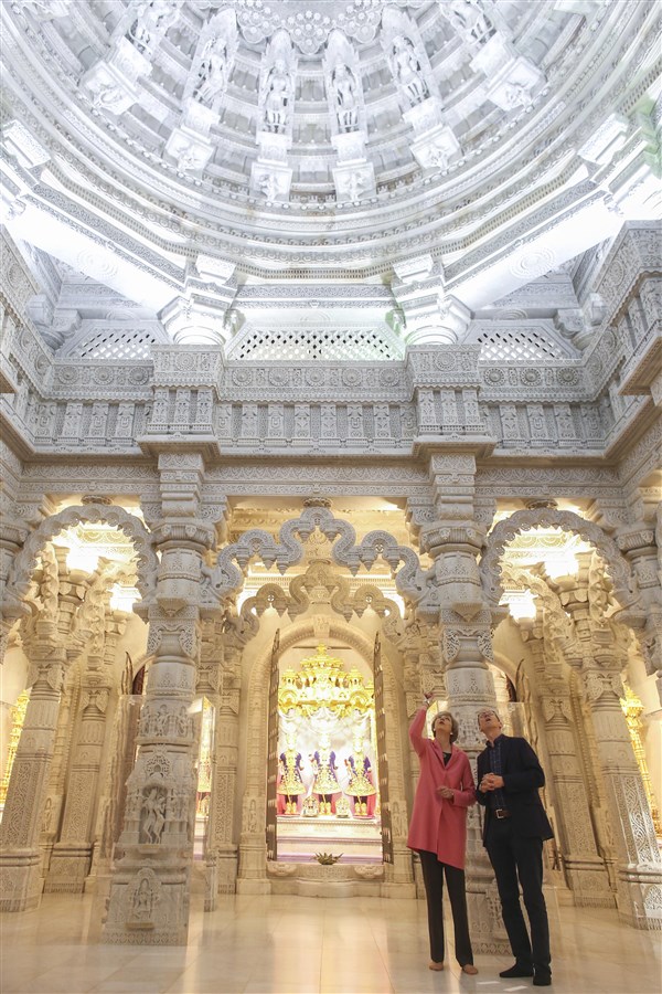 Prime Minister Theresa May and Mr May view the inner sanctum of the Mandir
