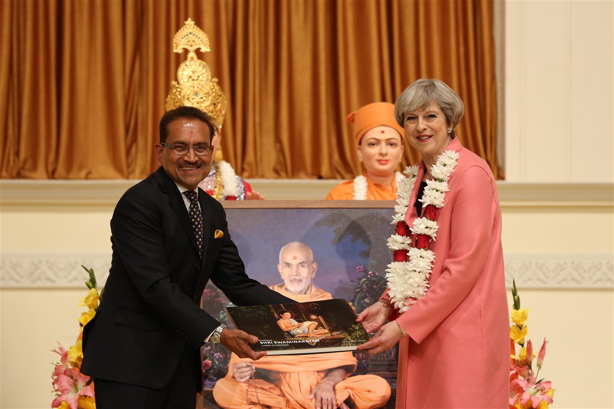Prime Minister Theresa May is gifted with mementos