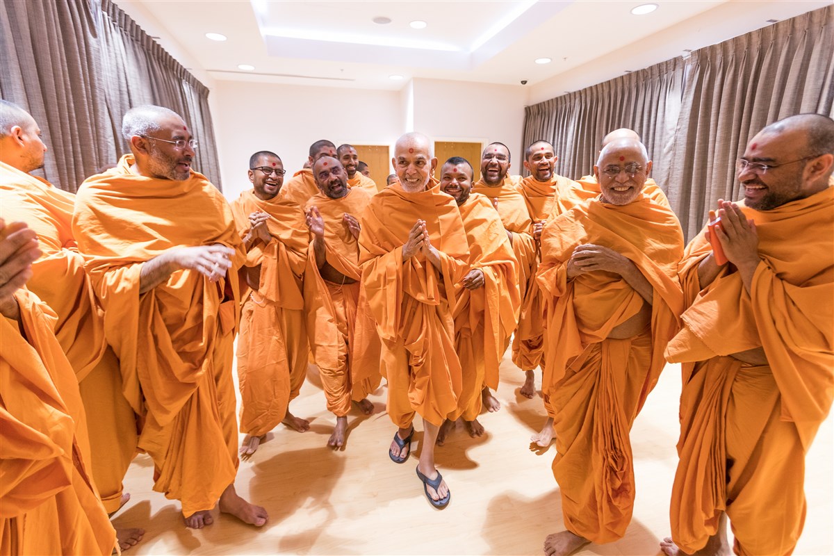 Param Pujya Mahant Swami Maharaj in a jovial mood while interacting with Pujya Swamis