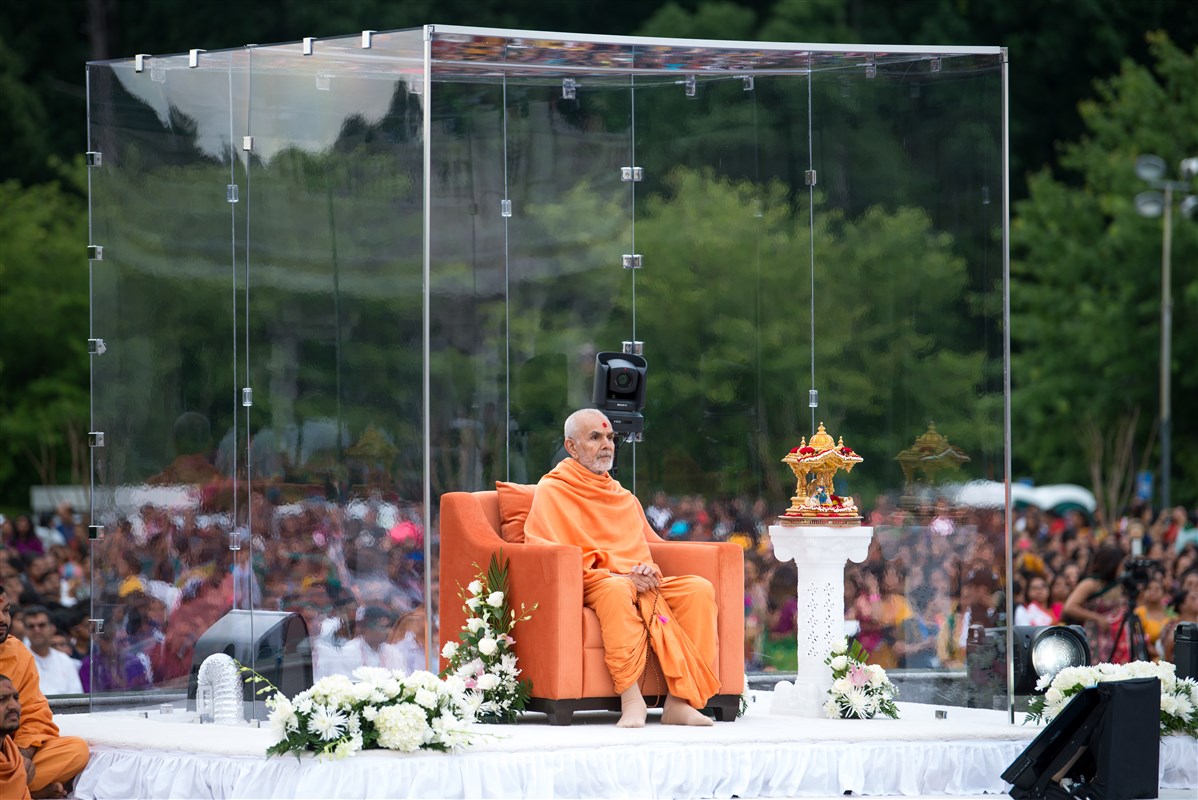Swamishri attentively observes the program