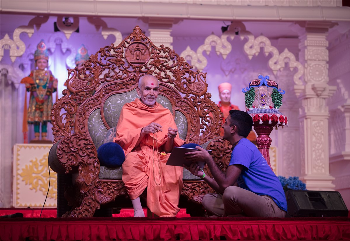 Swamishri engaged in the program