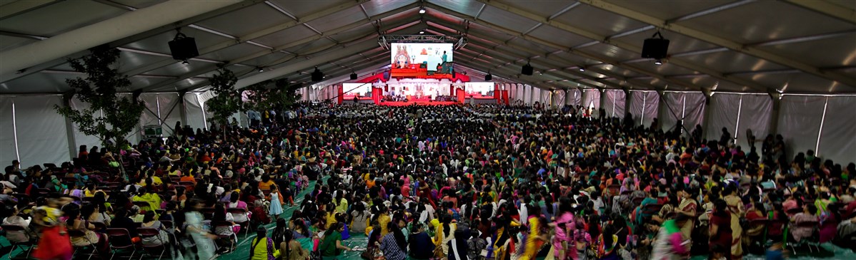 Devotees engaged in the program