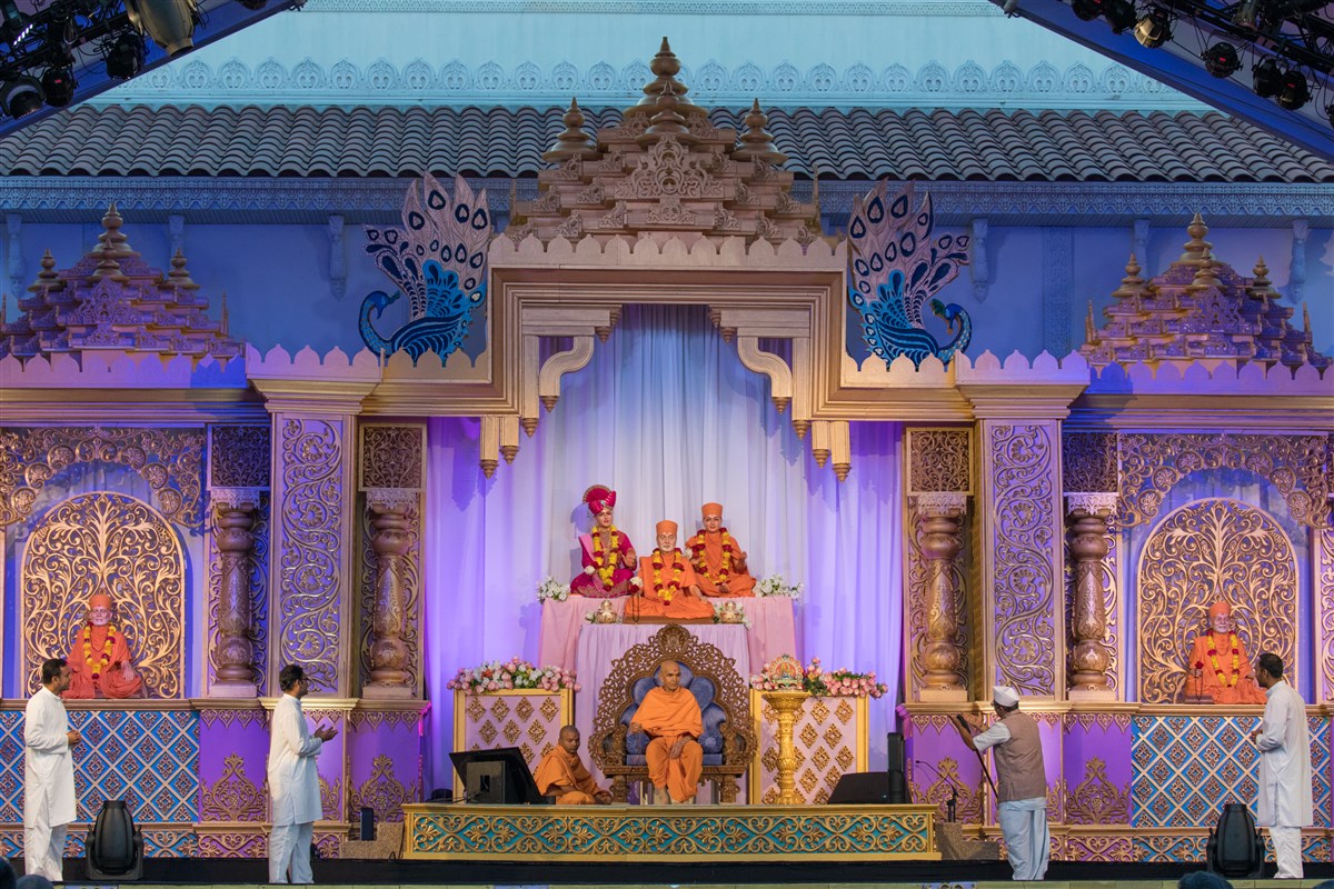 Devotees perform a skit before Swamishri