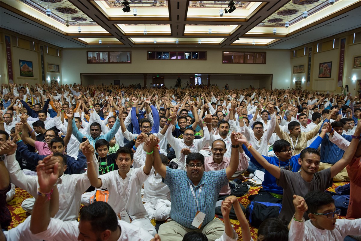 Devotees joins hands in a gesture of unity
