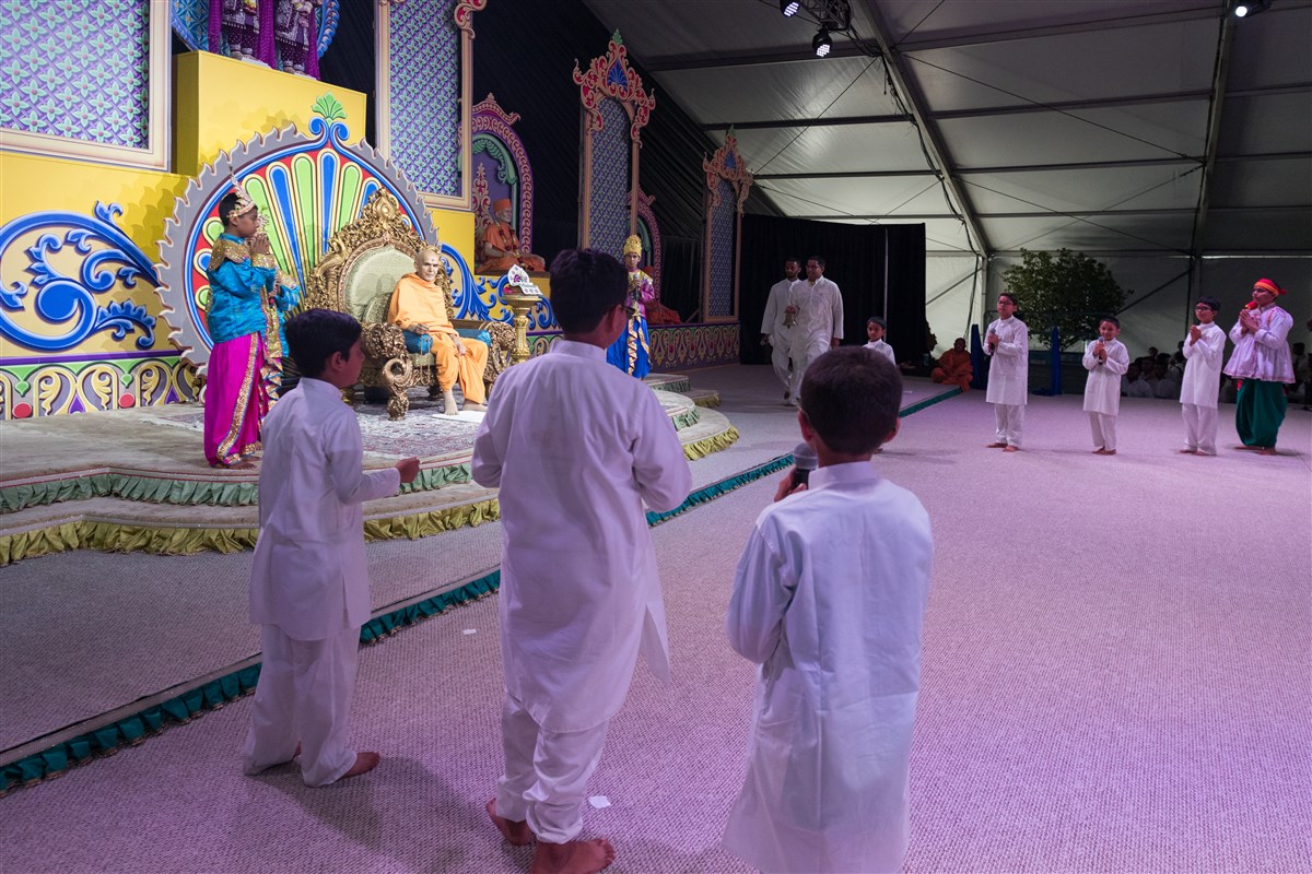 Children perform a skit before Swamishri