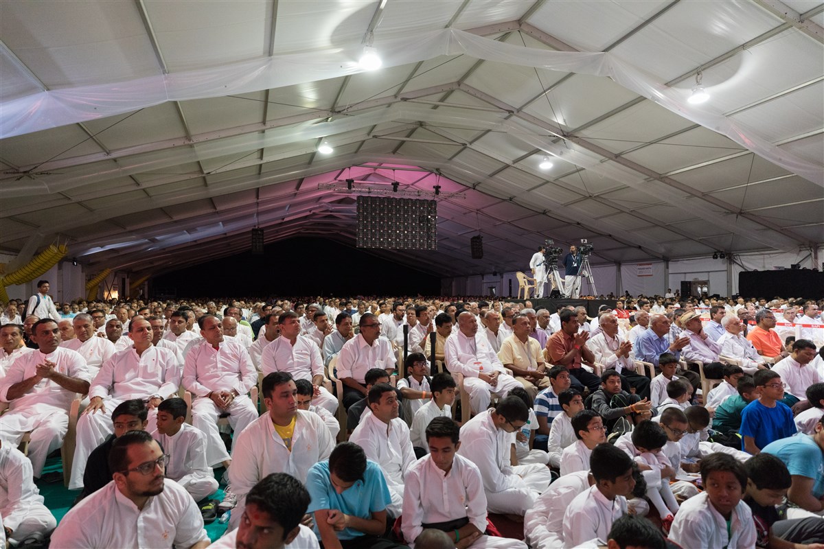 Devotees engaged in the assembly