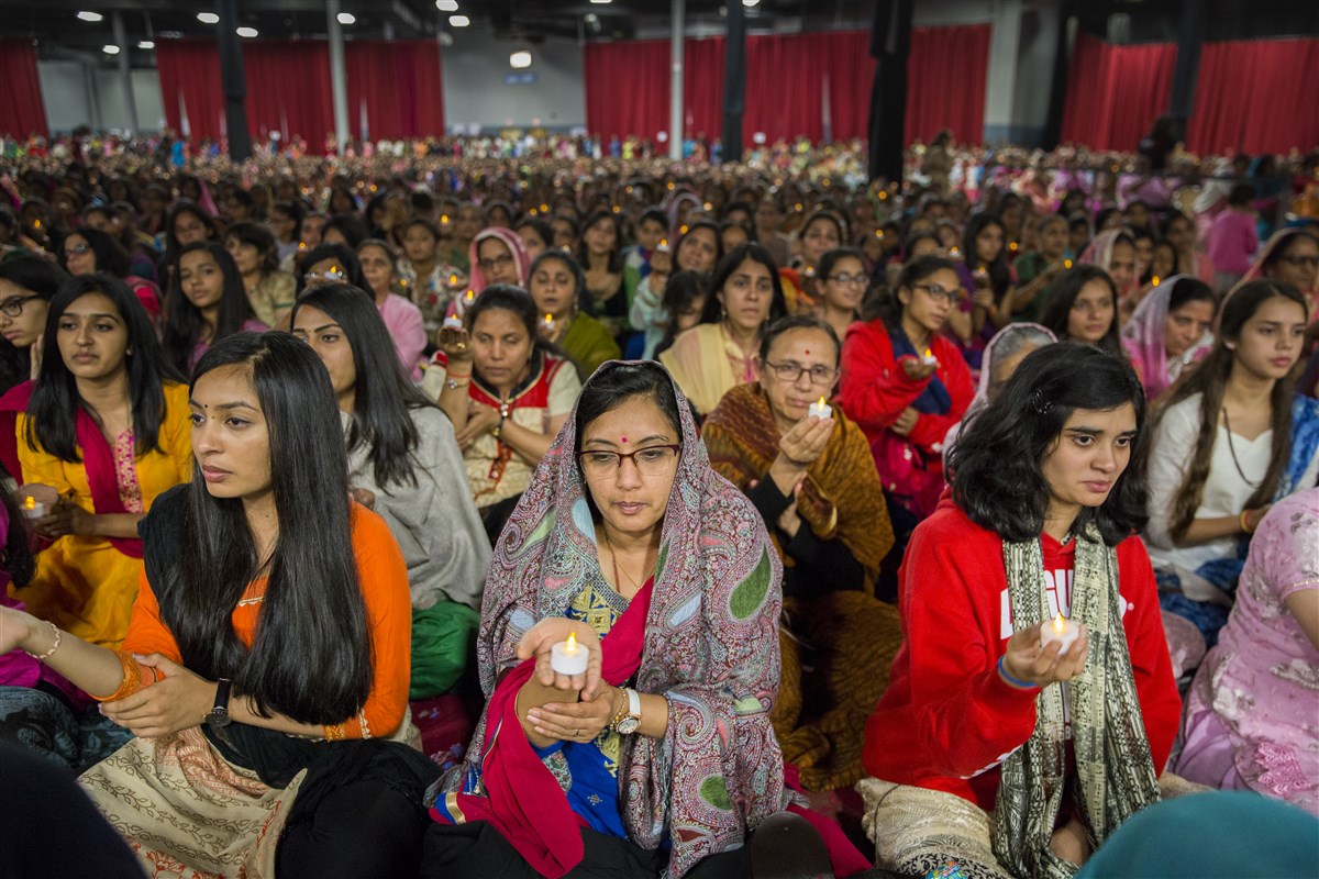 Devotees engaged in the arti