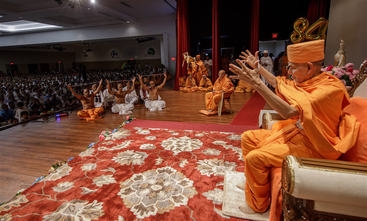Swamishri and three youths engaged in diksha ceremony