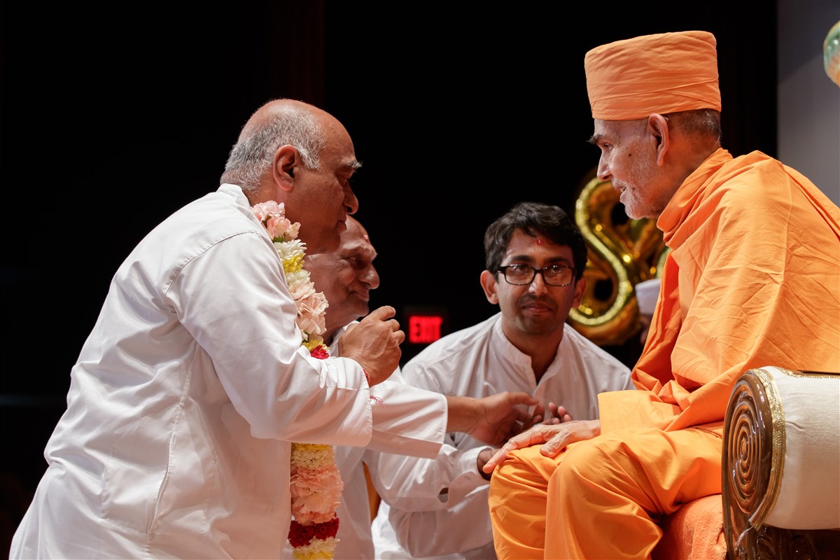 Swamishri blesses the family of the youths who received diksha