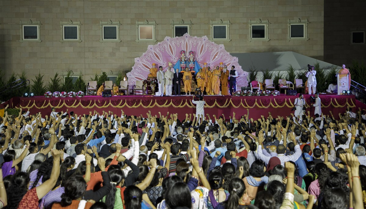 Swamis and devotees engaged in jaynad on this historical event