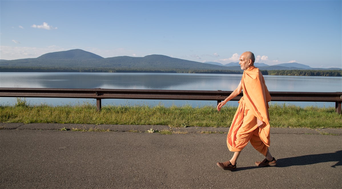 Swamishri engaged in his afternoon walk during the Sant Shibir, 18 September 2017