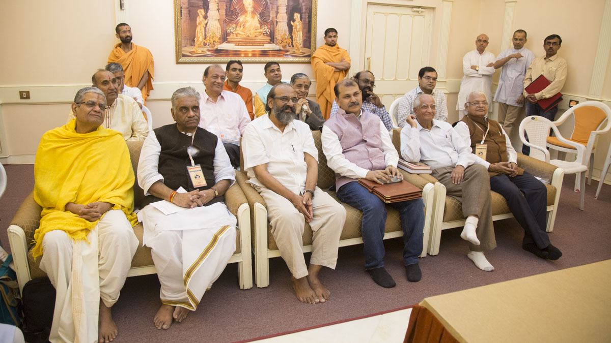 Scholars during the meeting with HH Mahant Swami Maharaj and senior swamis