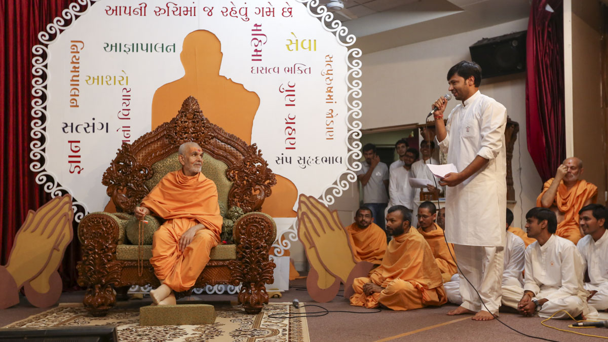 A youth presents before Swamishri