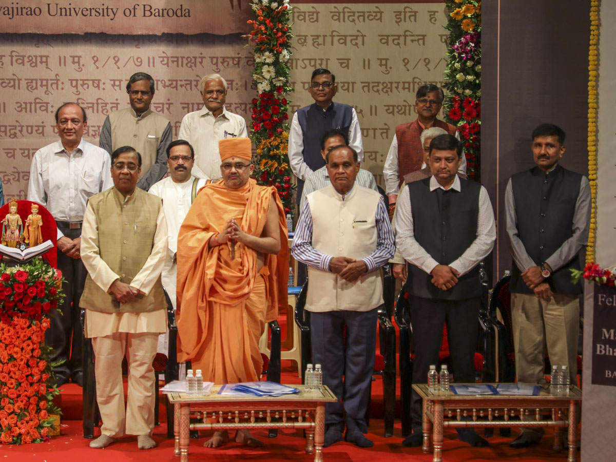 Senior sadhus, vice chancellors and university representatives on stage