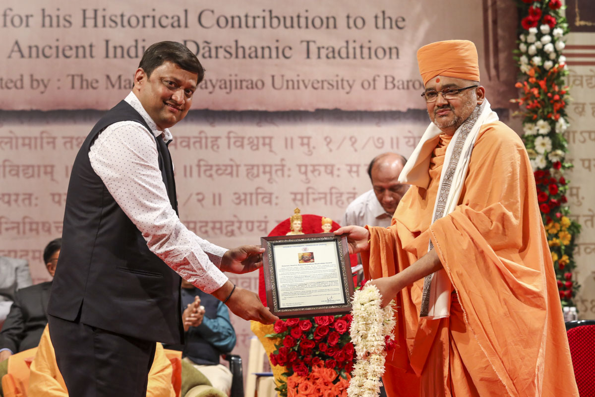 Vice Chancellor Dr. H.A. Pandya of Gujarat University, honors Bhadresh Swami