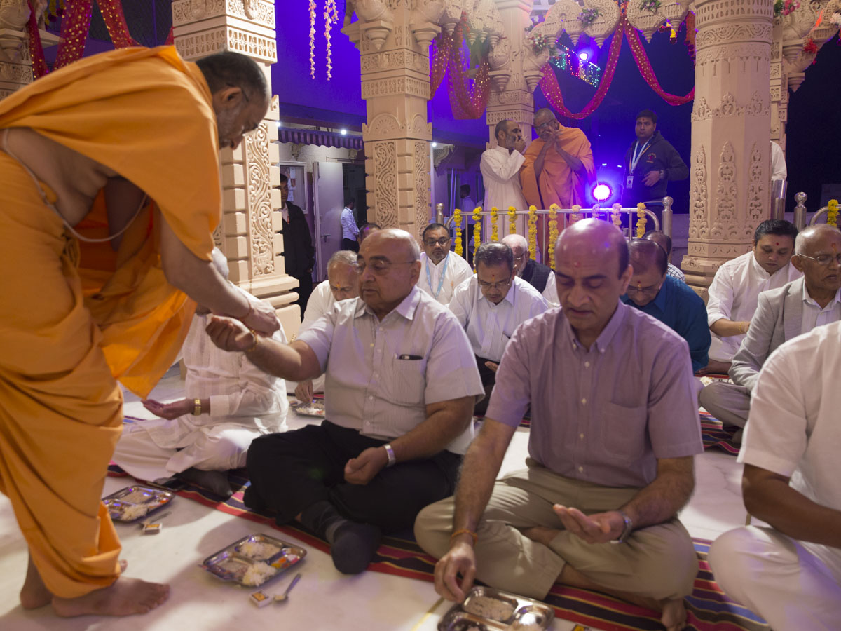 Devotees participate in mahapuja  