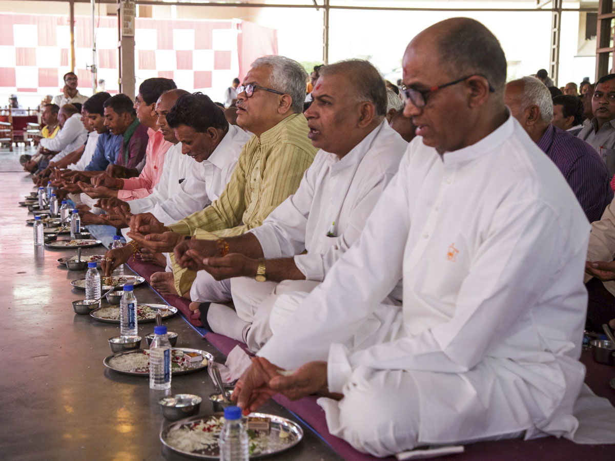 Fathers of the parshads participate in mahapuja rituals