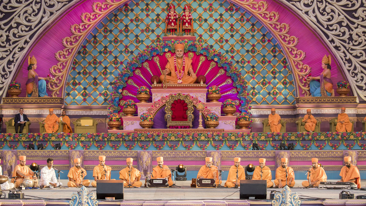Sadhus sings kirtans at the beginning of the celebration assembly