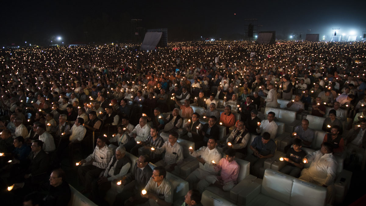 Devotees perform arti