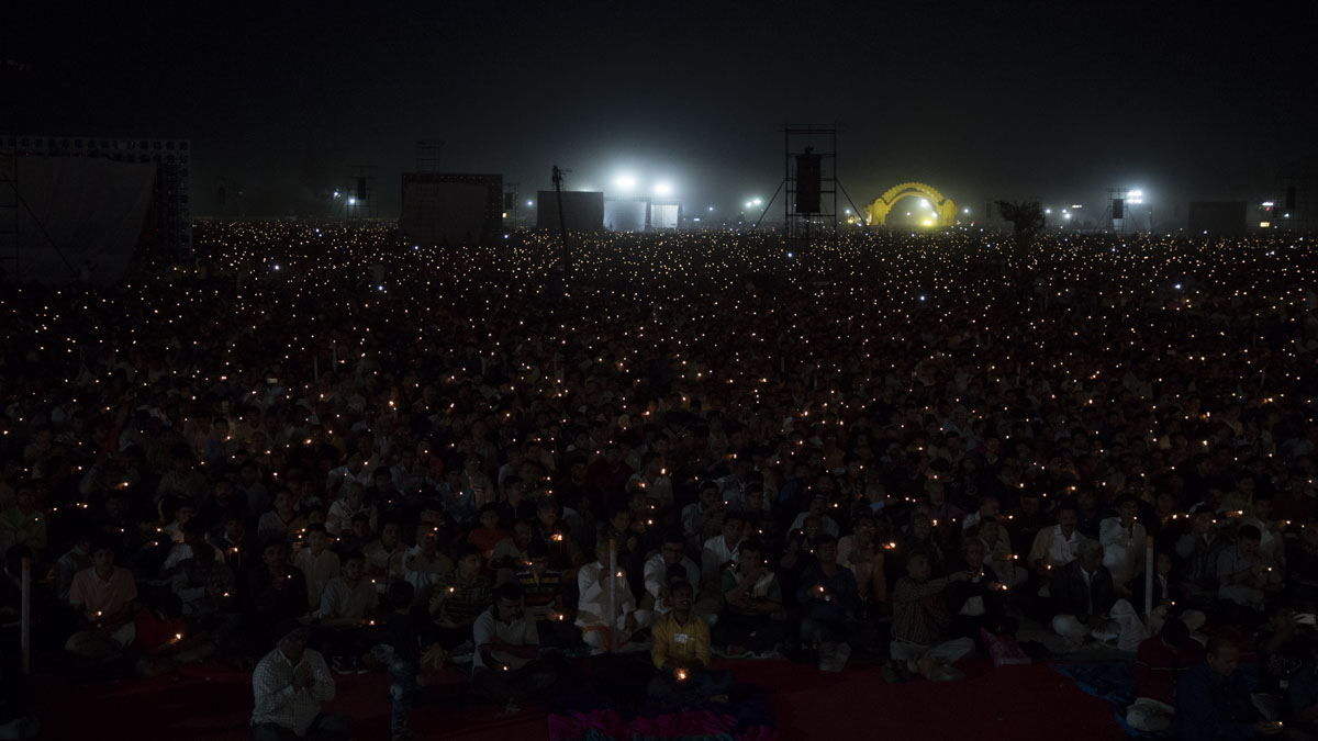Devotees perform arti