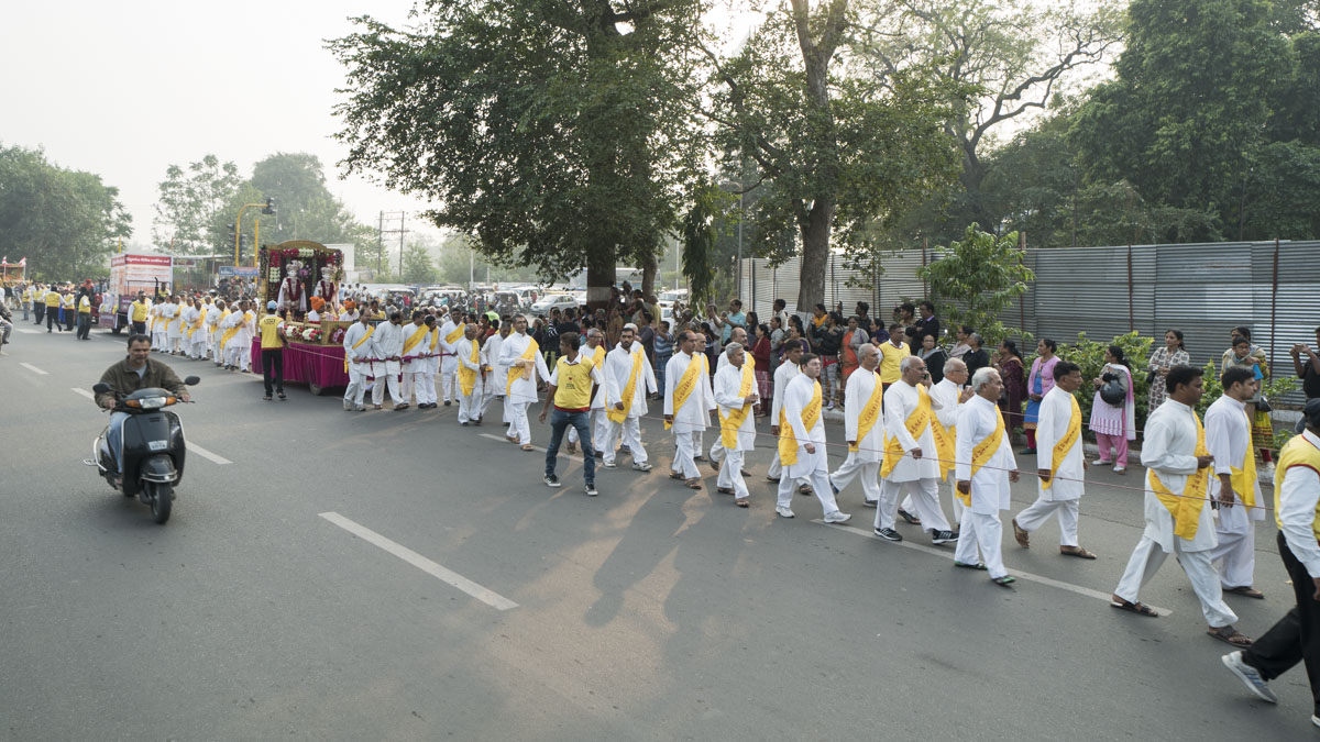 Devotees participate in the procession