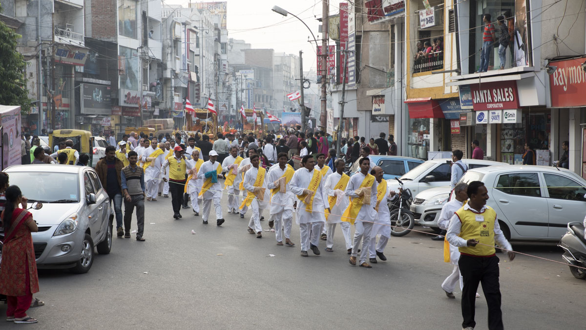 Devotees participate in the procession