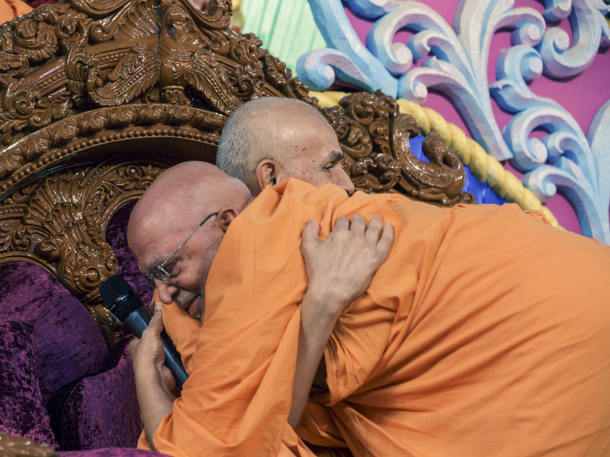 Pujya Ghanshyamcharan Swami embraces Swamishri
