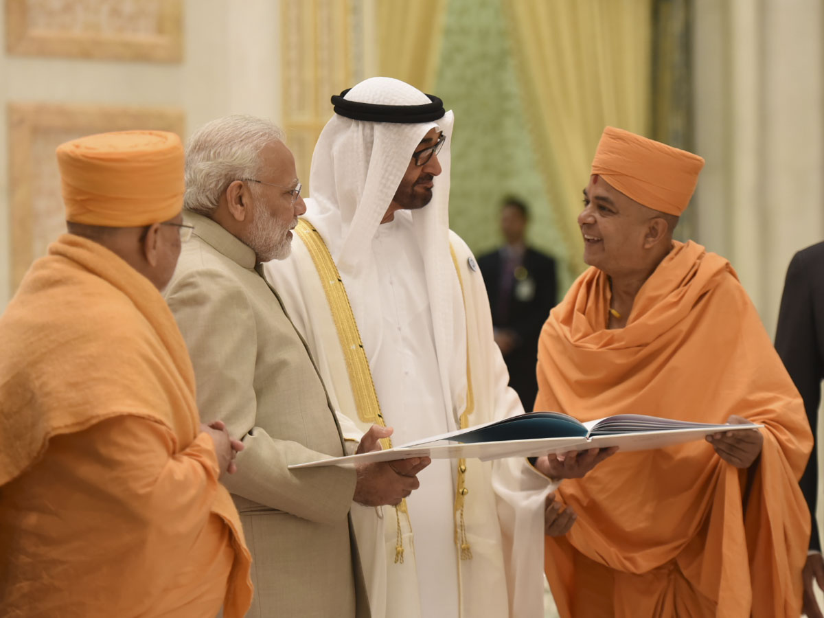 Crown Prince HH Mohamed bin Zayed al Nahyan and PM Narendra Modi are shown a book outlining the temple project