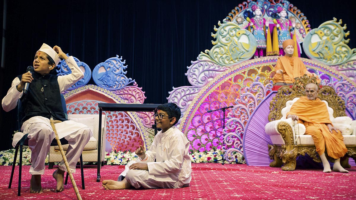 A skit presentation by children in the evening satsang assembly