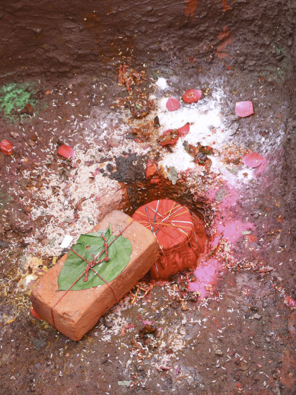 Sanctified kalash and a brick placed in the foundation pit