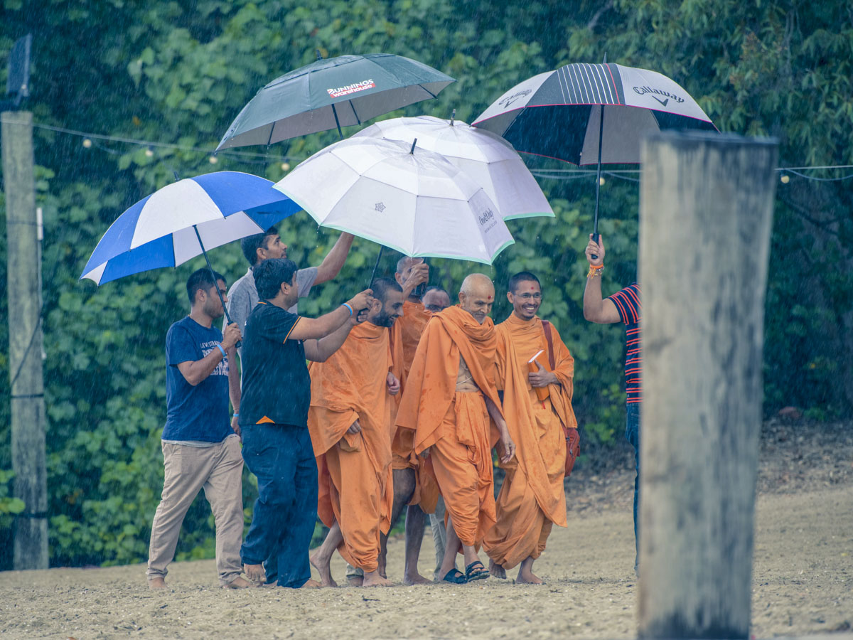 Swamishri on his way to the boat for asthipushpa visarjan