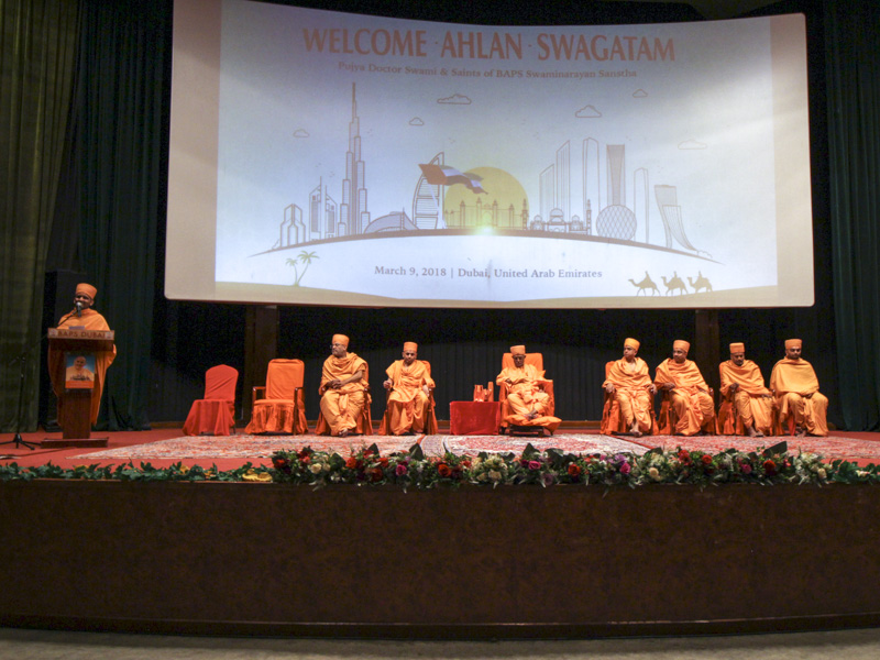Pujya Swayamprakash Swami (Doctor Swami) and sadhus on the stage during the assembly