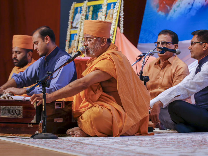 Sadhus and youths sing kirtans during the assembly