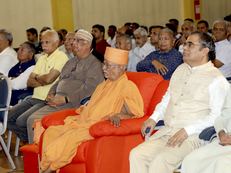 Pujya Doctor Swami and guests during the assembly