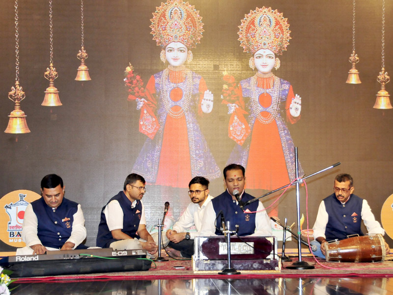 Youths sing kirtans during the assembly