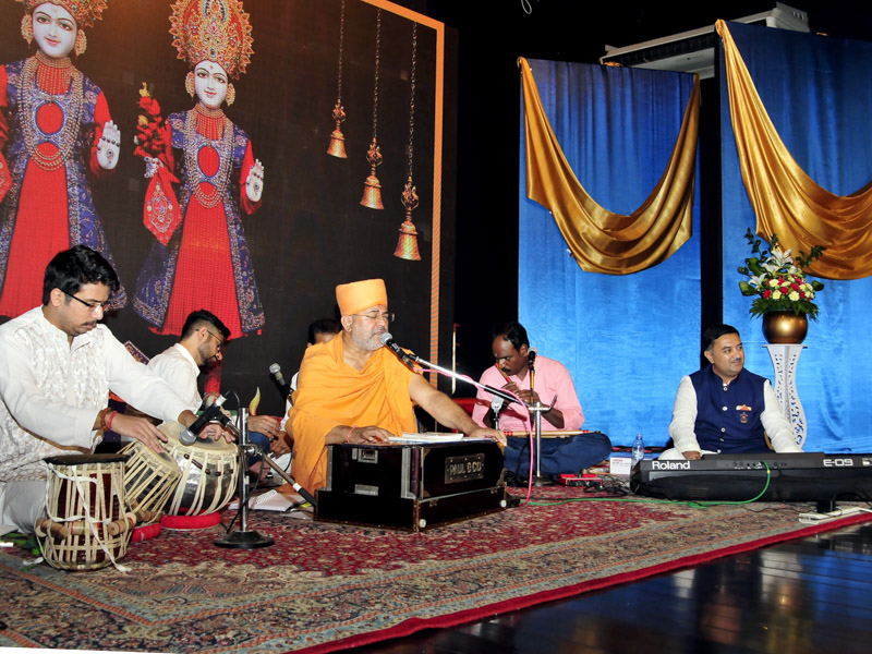 Sadhus and devotees sing kirtans