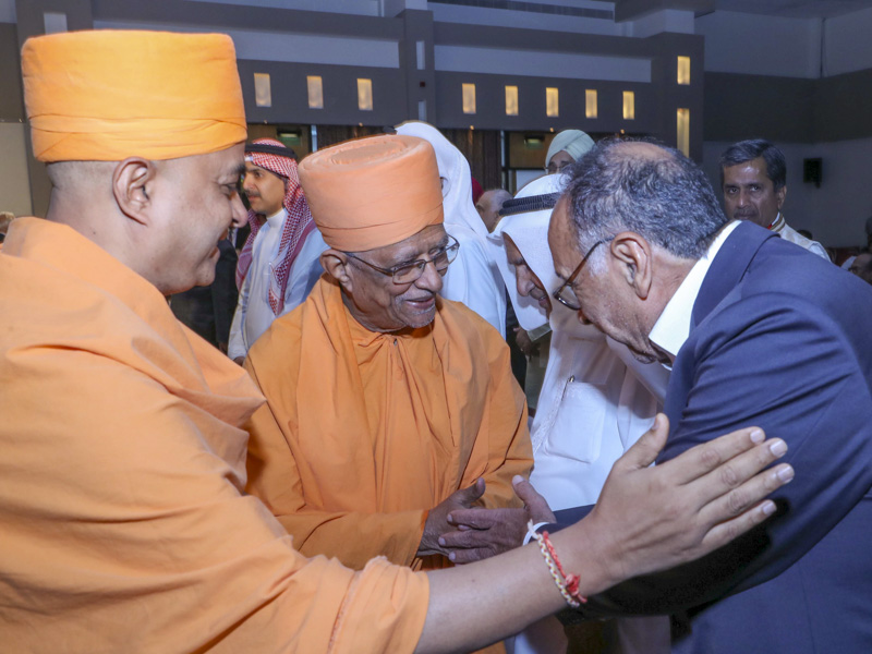 Pujya Doctor Swami greets a guest