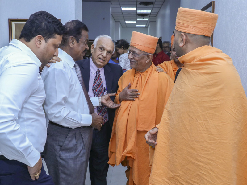 Pujya Doctor Swami greets a guest