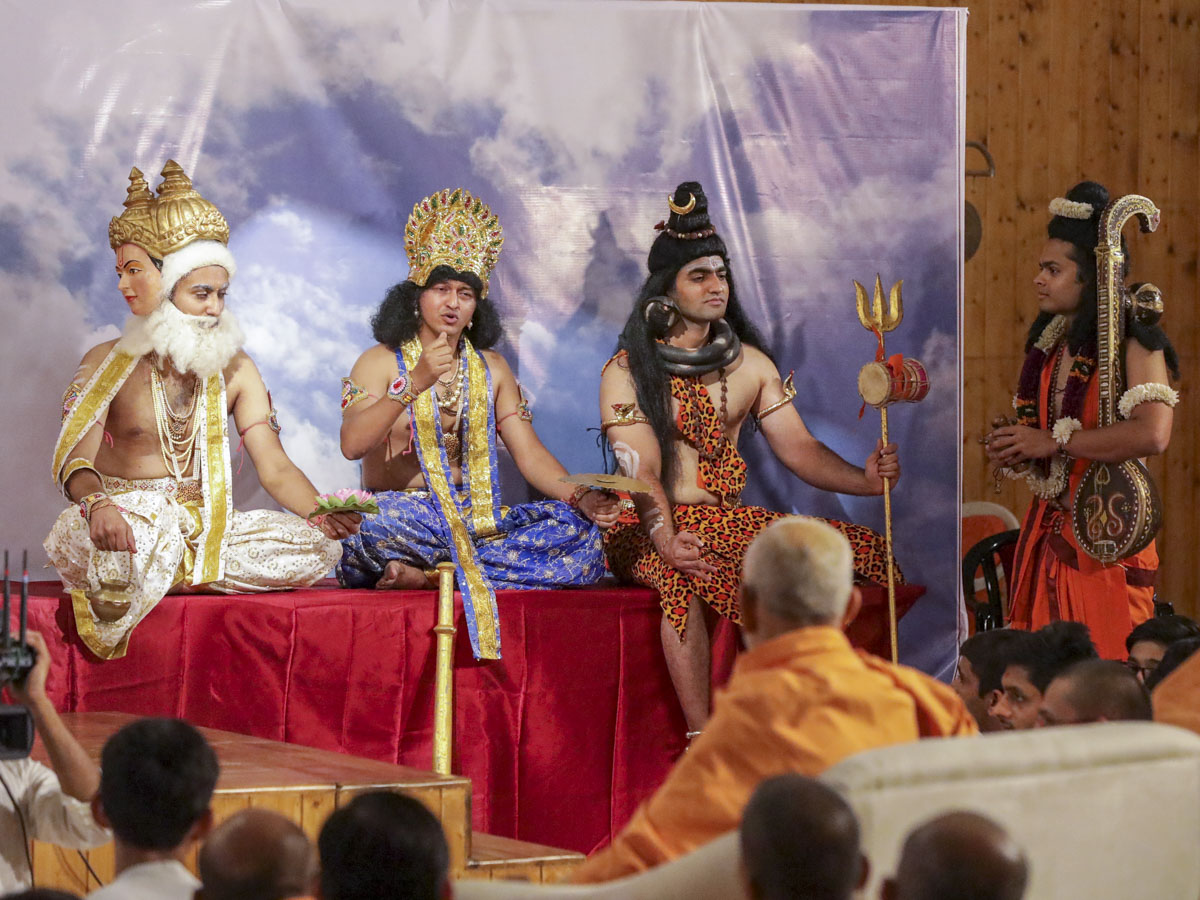 Youths perform a skit in the evening satsang assembly