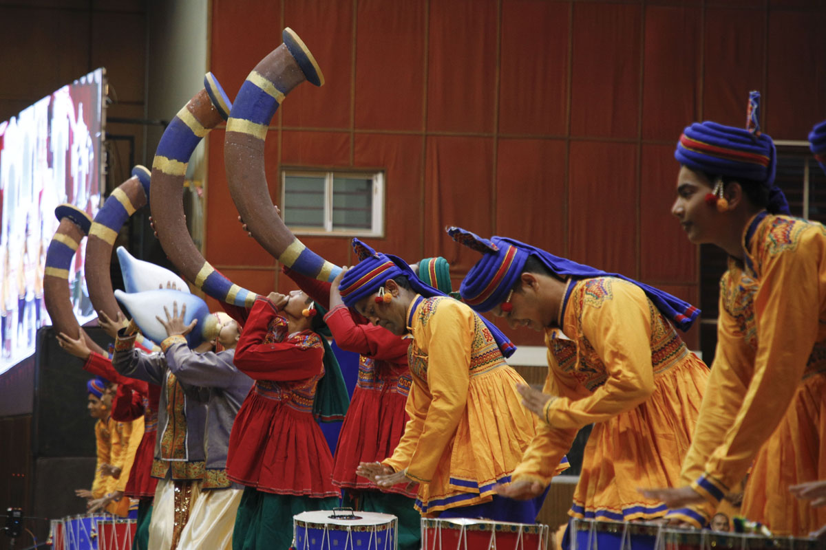 Youths perform a traditional dance in the assembly