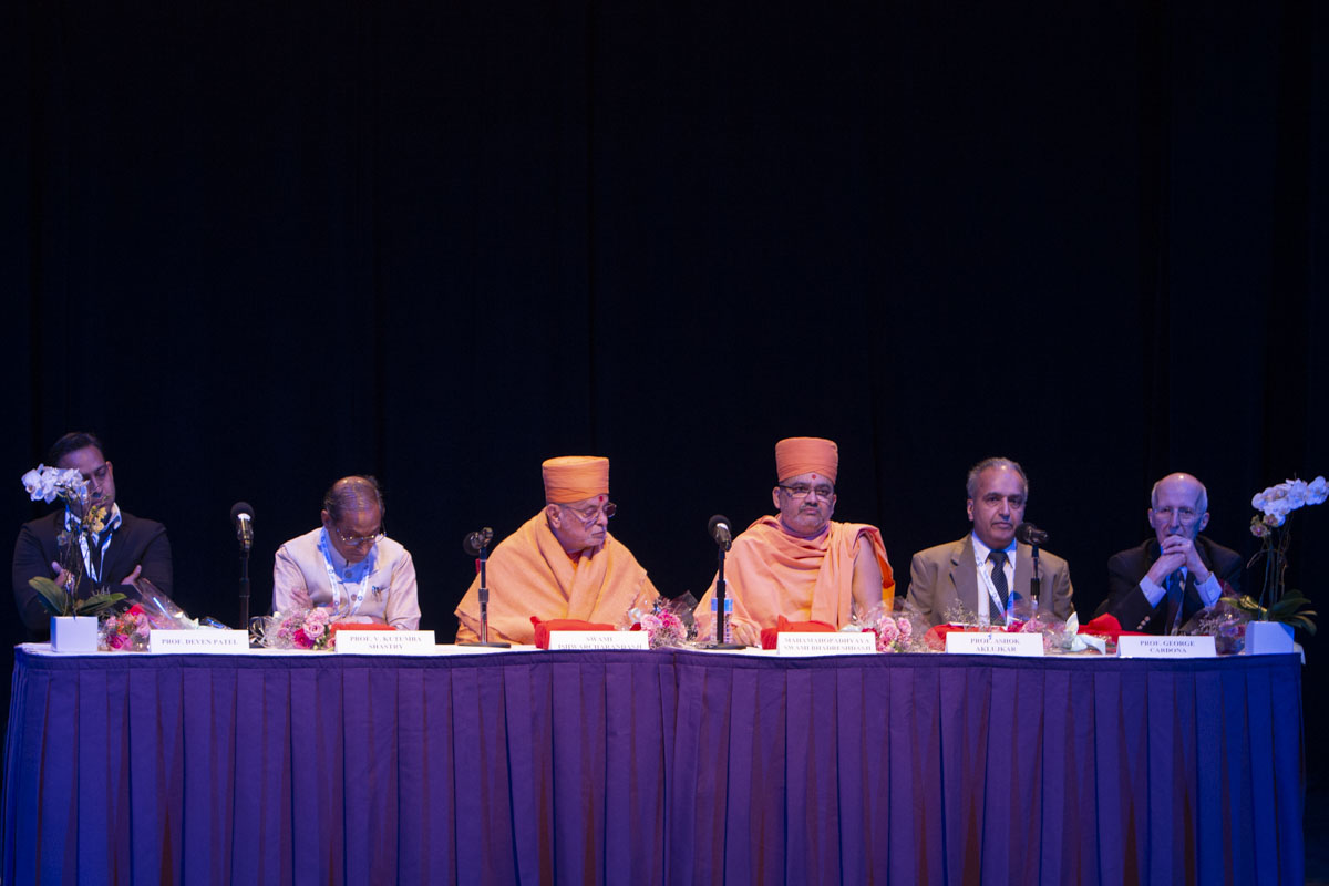 Distinguished Panelists during the World Sanskrit Conference’s Inaugural Session from left to right:  Prof. Deven Patel (Chair of Department of South Asian Studies, University of Pennsylvania), V. Kutumba Shastry (President, International Association of Sanskrit Studies. Head of Organizing Committee of World Sanskrit Conference), Pujya Ishwarcharan Swami, Mahamahopadhyaya Bhadreshdas Swami, Prof. Ashok Aklujkar (Member World Sanskrit Conference Secretariat, University of British Columbia), Prof. George Cardona (University of Pennsylvania).