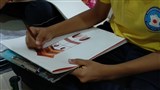 Students drawing during Masterstroke competition