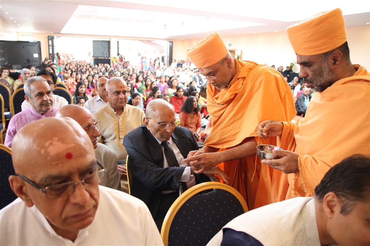 Devotees participate in the mandir inauguration mahapuja