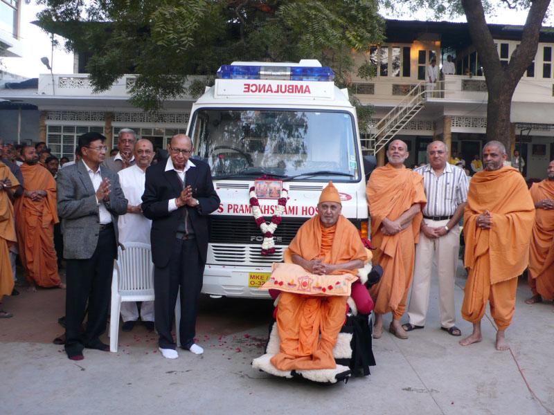 Swamishri sanctifies a new ambulance donated to Pramukh Swami Hospital