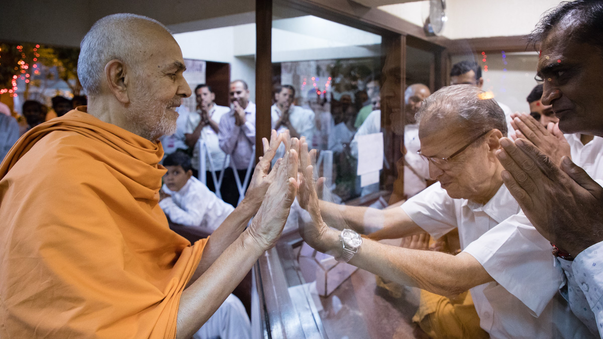 Swamishri blesses a blind devotee